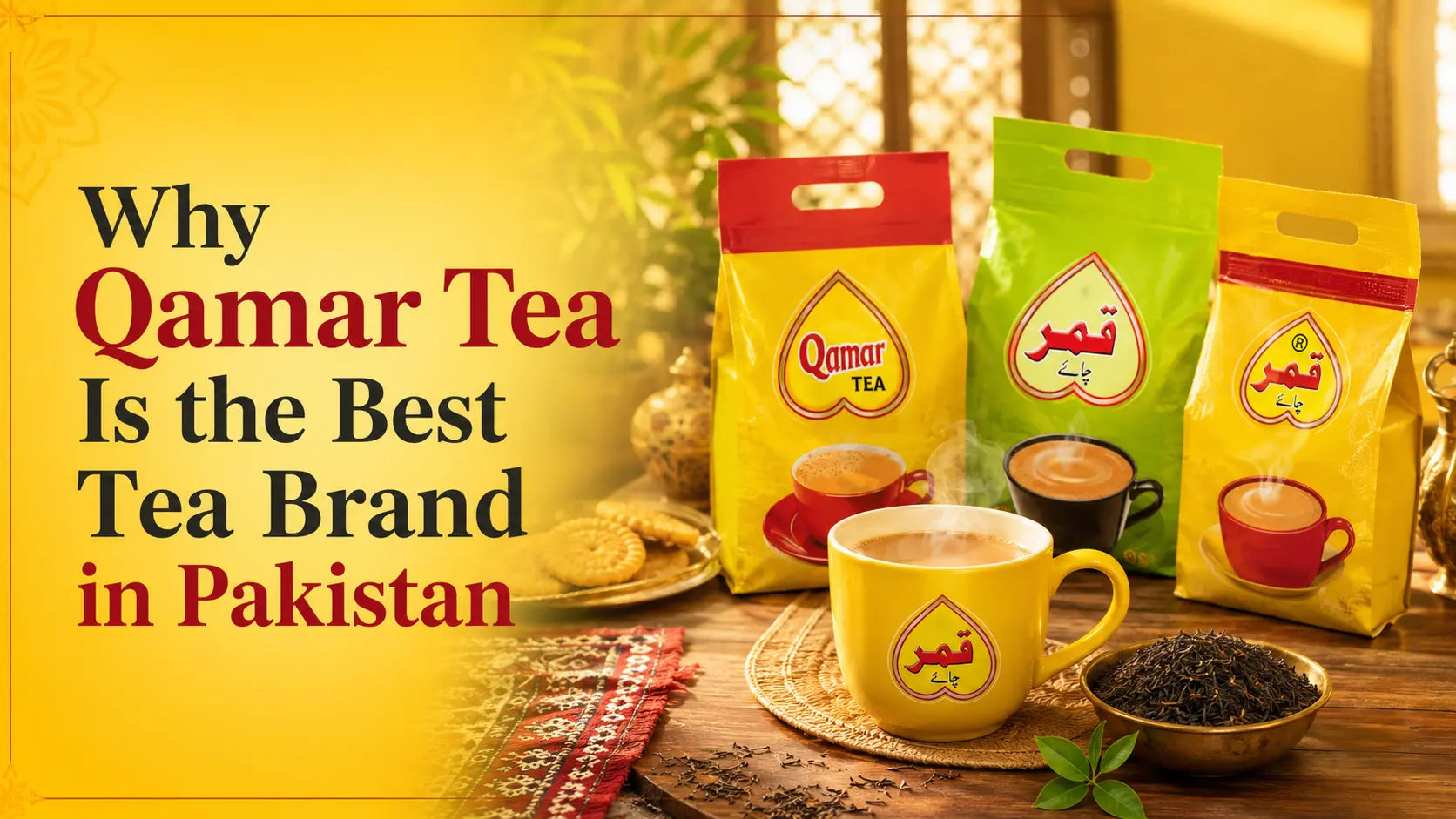 A steaming yellow mug of milk tea alongside Qamar Tea pouches, biscuits, and loose tea on a table.