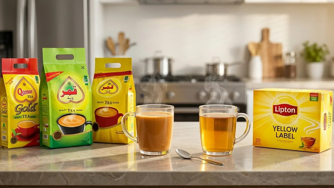Assorted Qamar Tea packs and Lipton Yellow Label boxes next to freshly brewed milk tea and black tea.